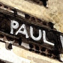 The word PAUL painted in watercolour