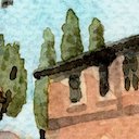 Corner of a rustic Tuscan building with cypress trees in the background